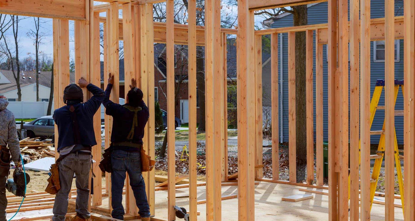 construction-worker-building-timber-frame-building-2022-11-12-10-59-51-utc.jpg