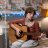 contemporary-teenager-playing-guitar-during-online-2022-01-31-15-16-21-utc.jpg