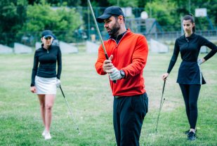 golf-lesson-golf-instructor-showing-swing-techniq-2023-11-27-05-26-30-utc.jpg