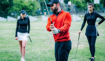 golf-lesson-golf-instructor-showing-swing-techniq-2023-11-27-05-26-30-utc.jpg