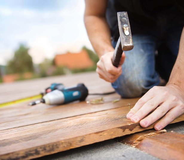 handyman-installing-wooden-flooring-2021-08-26-12-08-05-utc.jpg