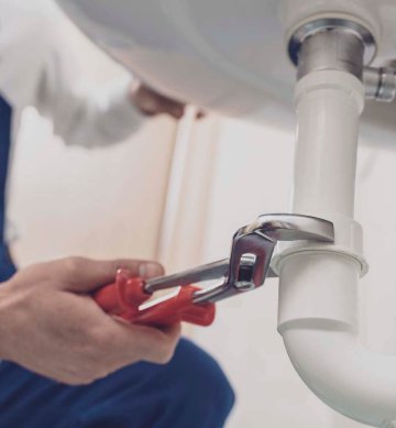 plumber-fixing-a-sink-at-home-2021-09-02-16-30-58-utc.jpg