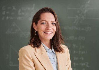 smiling-female-teacher-in-school-2022-08-25-18-39-15-utc.jpg