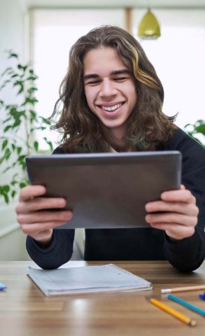 virtual-online-lesson-smiling-teenager-guy-learns-2022-05-25-01-01-43-utc.jpg